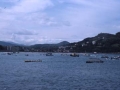 Llegada de las traineras a la bahía donostiarra, desde el Paseo Nuevo