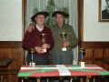 Jugadores del campeonato de mus, con trofeos en sus manos, en el interior del batzoki