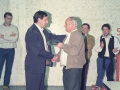 Acto de entrega de una placa. Detrás junto a la pared, Angel Iturbe